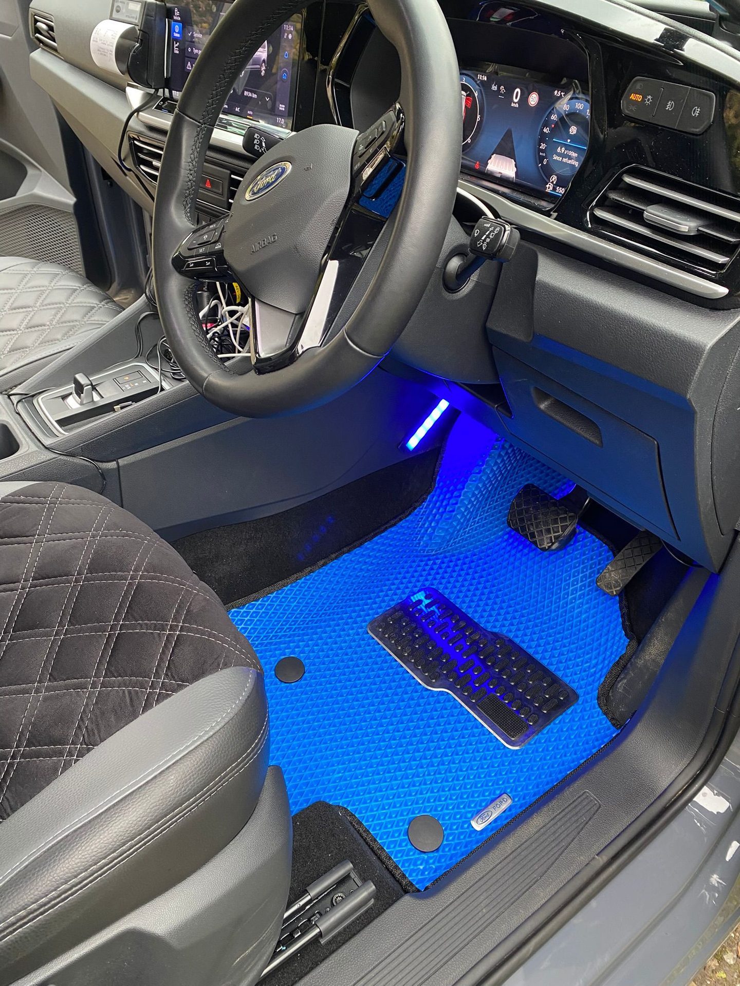 EVA mat with blue lighting in a Ford footwell