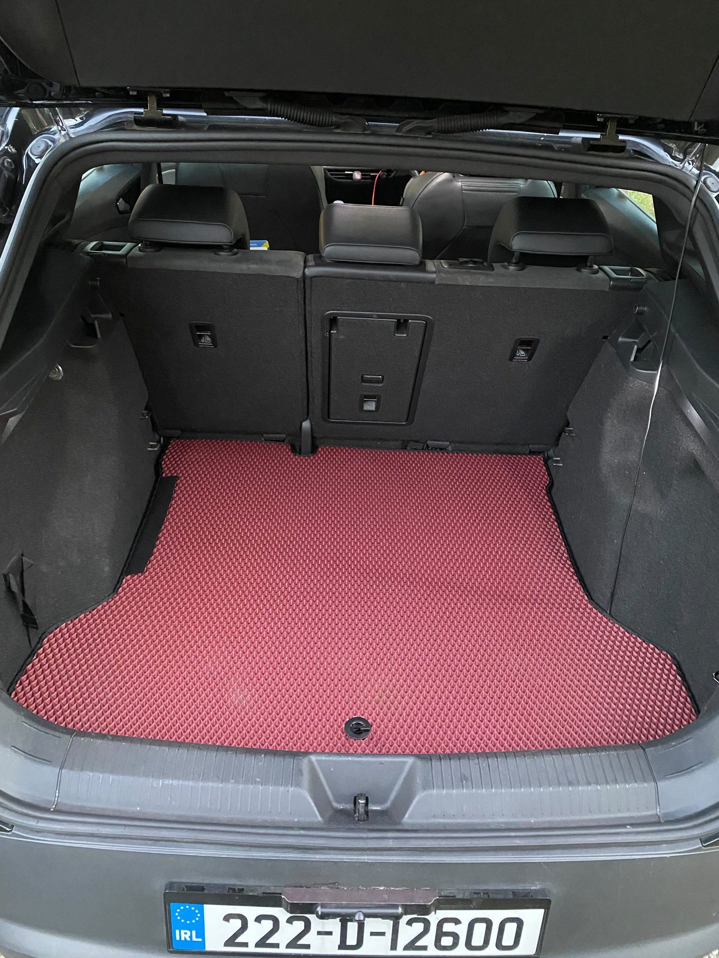 Red EVA boot mat fitted in a hatchback