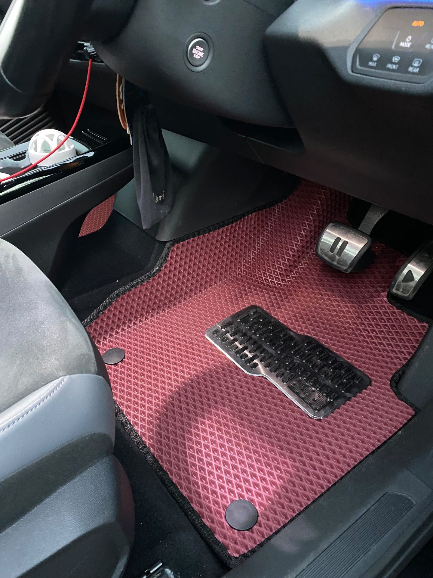 Red EVA driver mat fitted in a vehicle